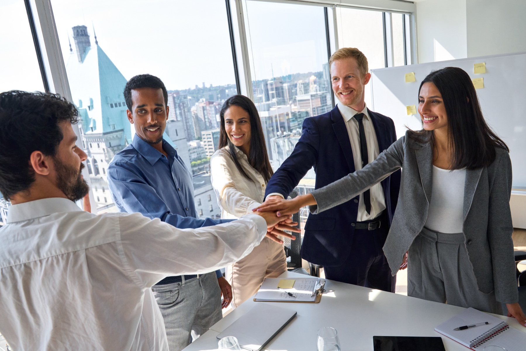 Team members joining hands
